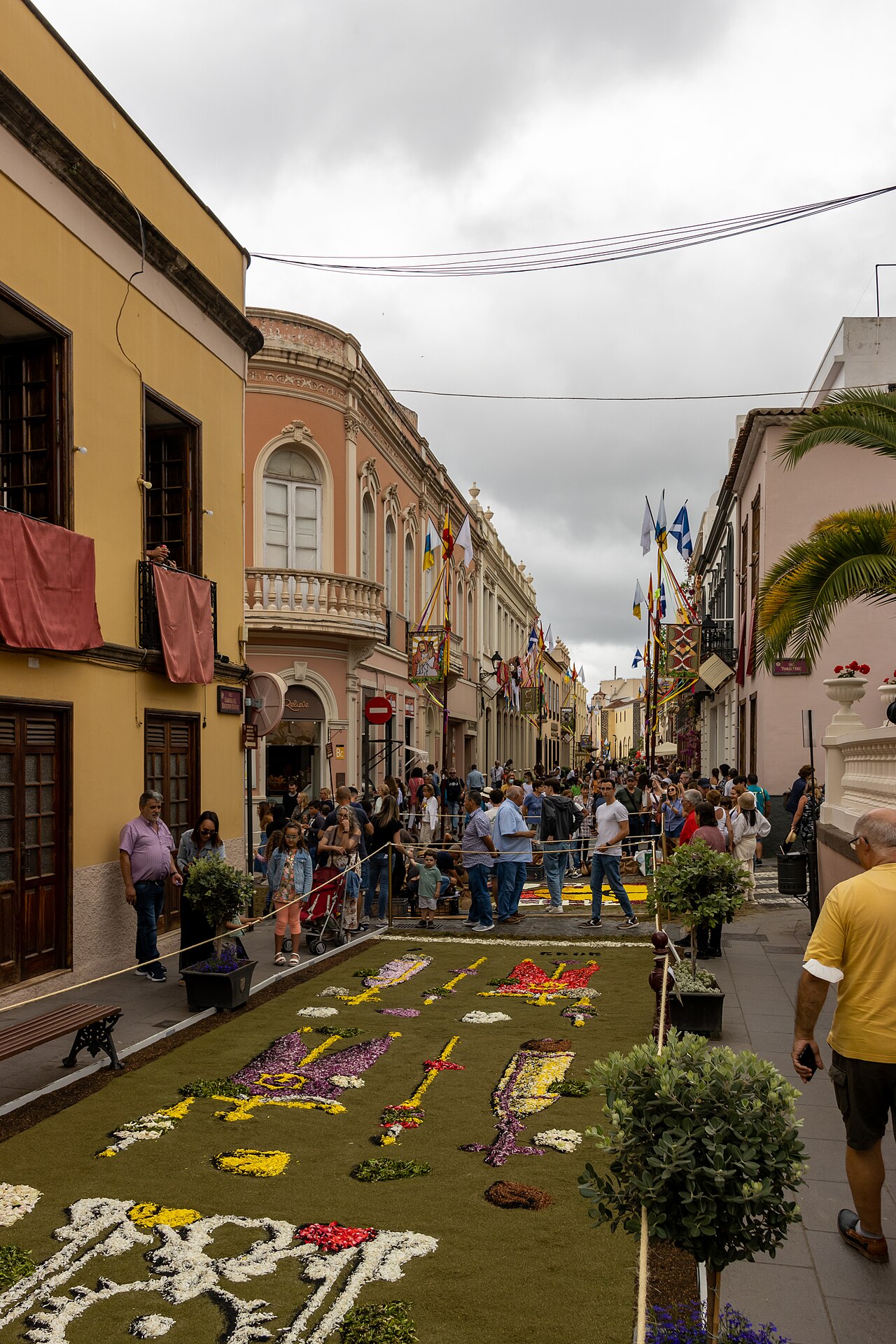 Corpus Christi flower carpets and spectators in La Orotava, Tenerife, on 23 June 2022, beside Plaza del Ayuntamiento.
