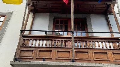Balcony of the old town hall of Telde with the Canarian, Spanish, and Teldense flags.